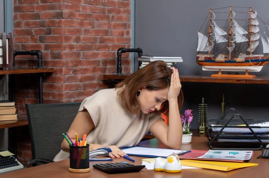 Ghostwriter working on book manuscript at desk